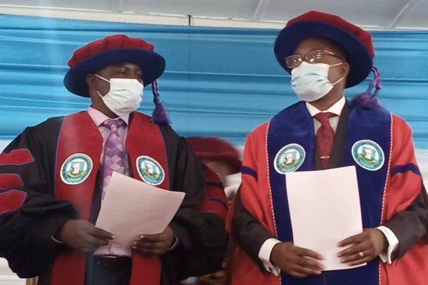 VC Professor Philip Duku Osei with another official at an event