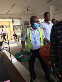 A hospital staff holding some of the donated items