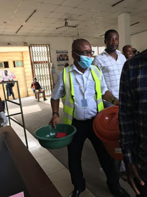 A hospital staff holding some of the donated items