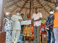 Nana Appiagyei Dankawoso I, presenting some items to the orphanage home leaders