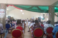 Rev Ayim ministering to the congregation