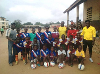 Jonathan Mensah (R) made the donated football, jerseys to the club