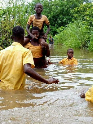 Students Crfossing River To School 