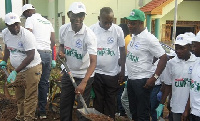 Apostle Onyina Gyamfi, Dansoman Area Head of The Church of Pentecost desilting the choked gutter