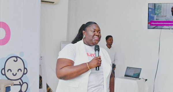 Dr. Karen Amaniampong addressing a health fair.