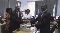 Eric Opoku (R) presenting the handing over notes of the donation to Dr. Anaab-Bisi