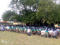 TASTECH students under a tree