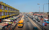 Accra, Ghana - July 19, 2010: People walking on the big market in the capital of Ghana, Acrca