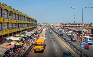 Accra, Ghana - July 19, 2010: People walking on the big market in the capital of Ghana, Acrca