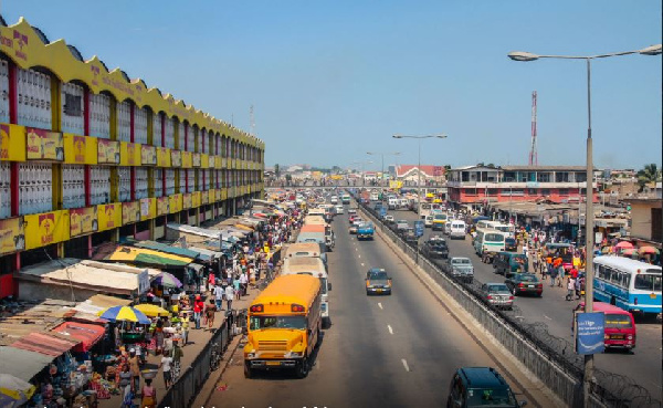 Accra, Ghana - July 19, 2010: People walking on the big market in the capital of Ghana, Acrca