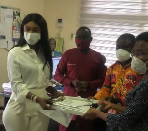 Becca presenting the items to the hospital officials