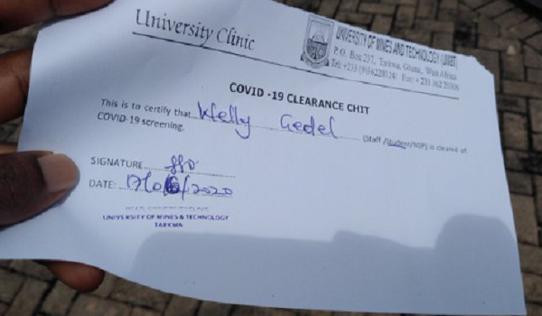 A photo of a COVID-19 clearance form issued to a student