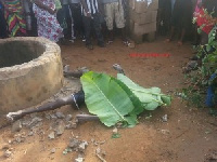 The body of the deceased covered with leaves