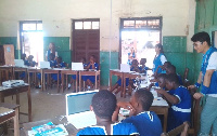 A cross-section of students being taught how to use the computer