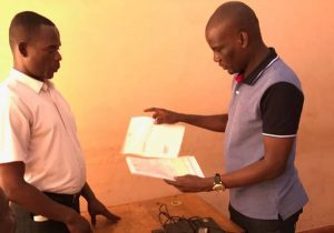 Haruna Iddrisu (Right) Returning his nomination paper to EC Official (Left)