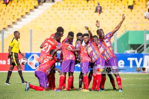 Hearts of Oak players engaging in a  pre match prayer