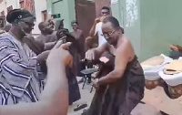 Dr Owusu Afriyie Akoto (in black cloth) daning at a funeral