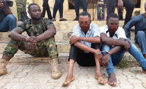 A photo of the arrested military personnel together with his accomplices