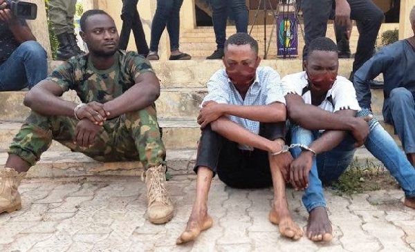 A photo of the arrested military personnel together with his accomplices