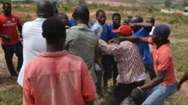 Photo of persons engaged in the scuffle