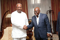 President Nana Addo Dankwa Akufo-Addo in a handshake with Former President John Dramani Mahama