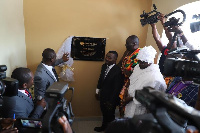 Richard Nii Armah Quaye unveiling the plaque of Quick Angels with John Kumah