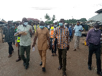 MCE Simon Kweku Tetteh flanked by his men