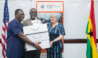 US Ambassador, Stephanie Sullivan donating technology to EOCO boss, Frank Adu-Poku & Jacob Puplampu