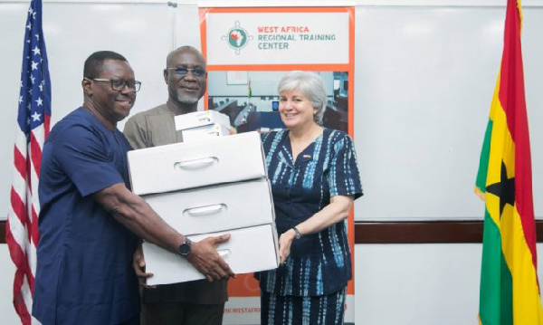 US Ambassador, Stephanie Sullivan donating technology to EOCO boss, Frank Adu-Poku & Jacob Puplampu