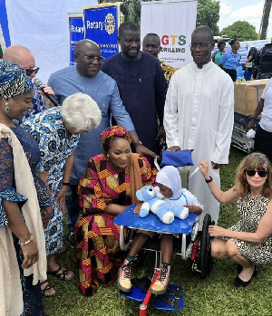 Her Excellency Samira Bawumia (centre) with a wheelchair recipient Elizabeth Newman on her left