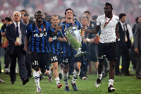 Sulley Ali Muntari and Mario Balotelli with the 2010 UEFA Champions League trophy