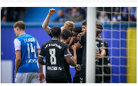 Daniel Heber celebrates with teammates after scoring a remarkable goal against Hansa Rostock