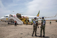 Senegalese authorities and airport staff unload cargo, | SADAK SOUICI | AFP