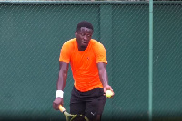 Asamoah Gyan playing tennis