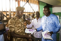 Alhaji Mohammed Adan ,NPP Regional Chairman hopeful with an inmate and a prison officer