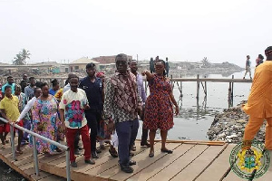 Ursla Owusu Ekuful with Prof Kwabena Frimpong-Boateng inspecting the bridge