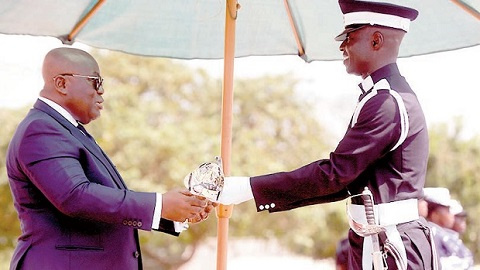 President Akufo-Addo presenting the best Cadet Officer award to C.O. Michael Bernard Adjei