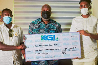 Kwame Sefa Kayi with the dummy cheque