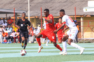 Asante Kotoko player, Goerge Mfegue going past his marker