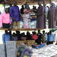 Mrs Adwoa Amoako presenting items to the Muslim communities within Tema West Municipality