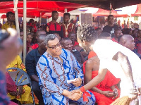 NDC's presidential aspirant, Goosie Tanoh in a handshake with one of the supporters at the funeral