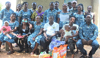 NABCO officials in a group picture with the woman and her children