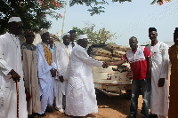 MP for the area, Joseph Kofi Adda presenting items to the Central Imam, Murabbi Akolbila