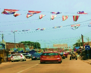 Faded and frayed banners of political parties still hanging from poles on the streets of Accra