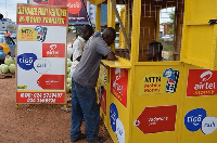 A Mobile Money agent serving clients