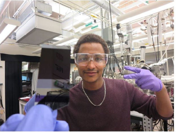 Dr. Azunre in MIT Lab with Invented Solar Coating