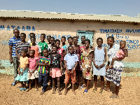 Group photo of caretakers and the children