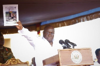 Akufo-Addo displaying the Ghana Beyond Aid document at the May Day celebrations