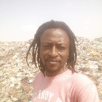 The deceased standing close to a refuse dump in the Ejura area.