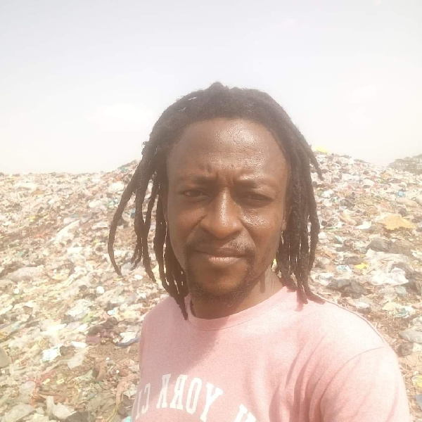 The deceased standing close to a refuse dump in the Ejura area.